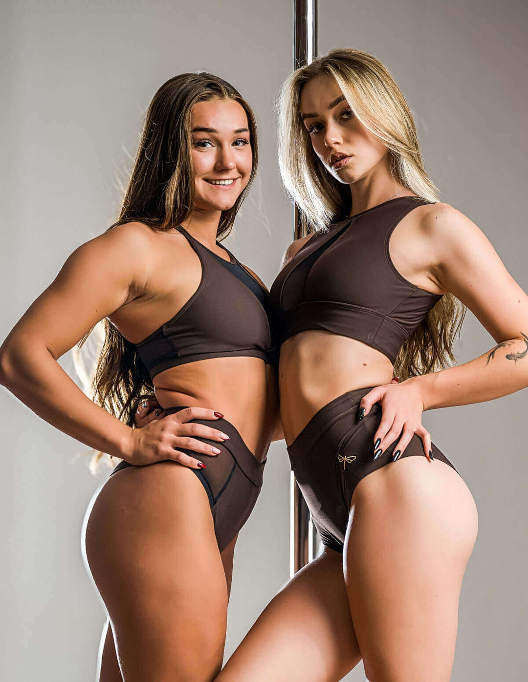 Mesh pole shorts Molly showcased by two models, highlighting the stylish high-waisted design for pole dancing.